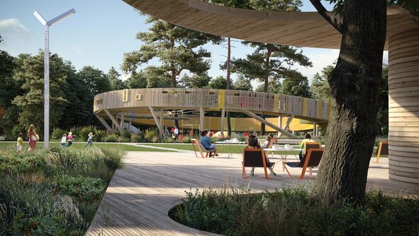 Au cœur du parc, une grande structure en bois en forme d'anneau parsemée de jeux originaux pour enfants.